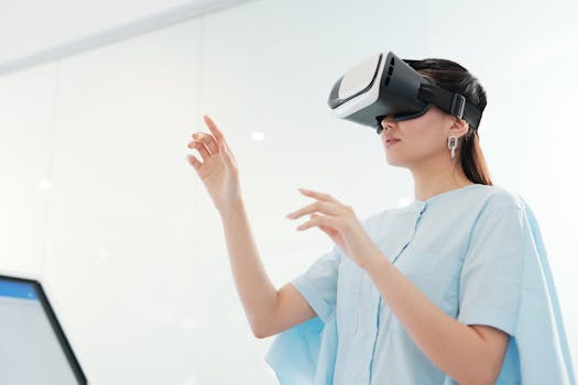 An Asian woman focuses on interacting with a virtual reality headset indoors.