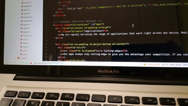 Close-up of HTML code displayed on a MacBook Pro screen, showcasing modern web development.