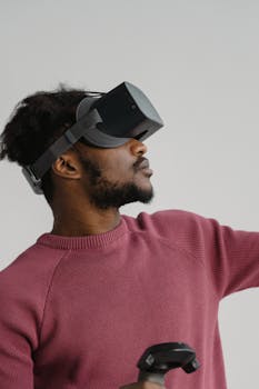 Side view of an adult man using a VR headset, reaching out with a controller.